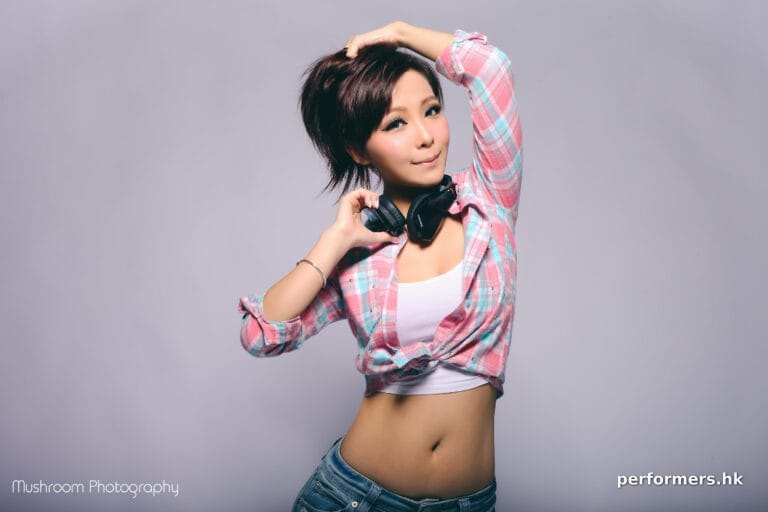 female dj z wing HK holding headphones