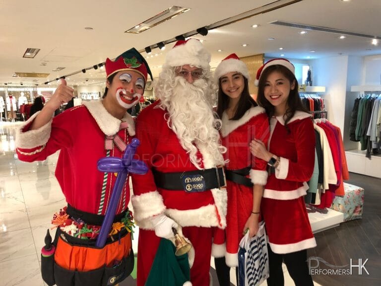 sogo tst performance from performers hk with balloon elf and santa and lady santa all dressed in red