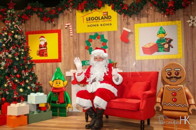 santa sitting in red chair in hong kong legoland tst