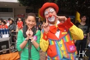 Roving clown taking picture with with TVB artist Tsui Zi San at a Hong Kong corporate function