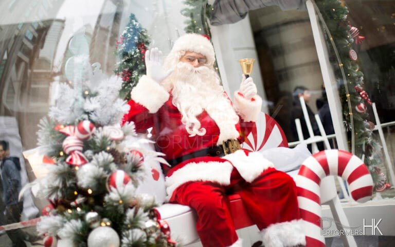 Santa waving to camera sitting on this throne at citiplaza