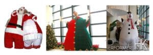 fat brothers giant stilt walker in elf costume in front of xmas tree in repulse bay