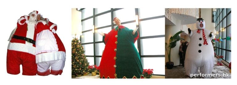 fat brothers giant stilt walker in elf costume in front of xmas tree in repulse bay