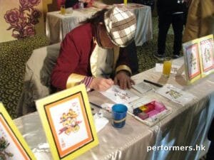 Hong Kong rainbow calligraphy artist  drawing a unique calligraphy at a Corporate annual dinner