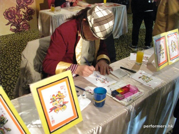 Hong Kong rainbow calligraphy artist  drawing a unique calligraphy at a Corporate annual dinner