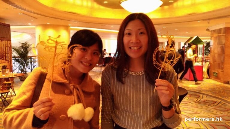 2 female event goer at hotel in hung hum hong kong for hsbc hk event with Sugar painting (糖画)