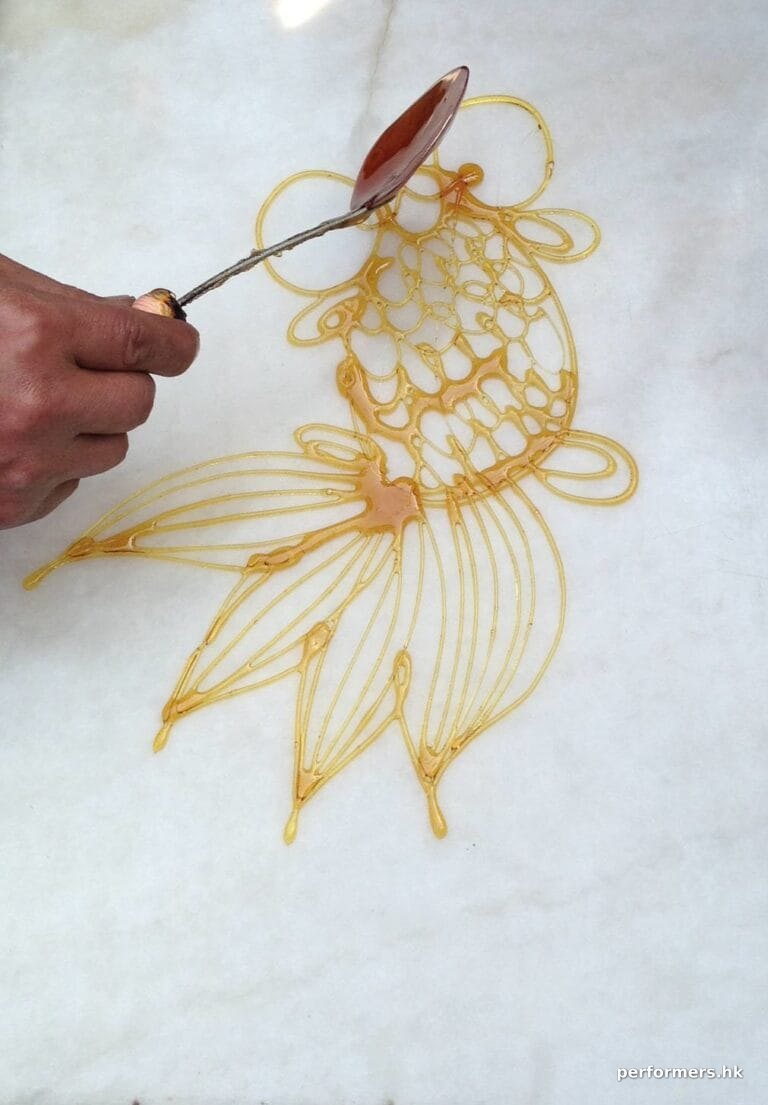 marble surface with goldfish Sugar painting (糖画) on at an event
